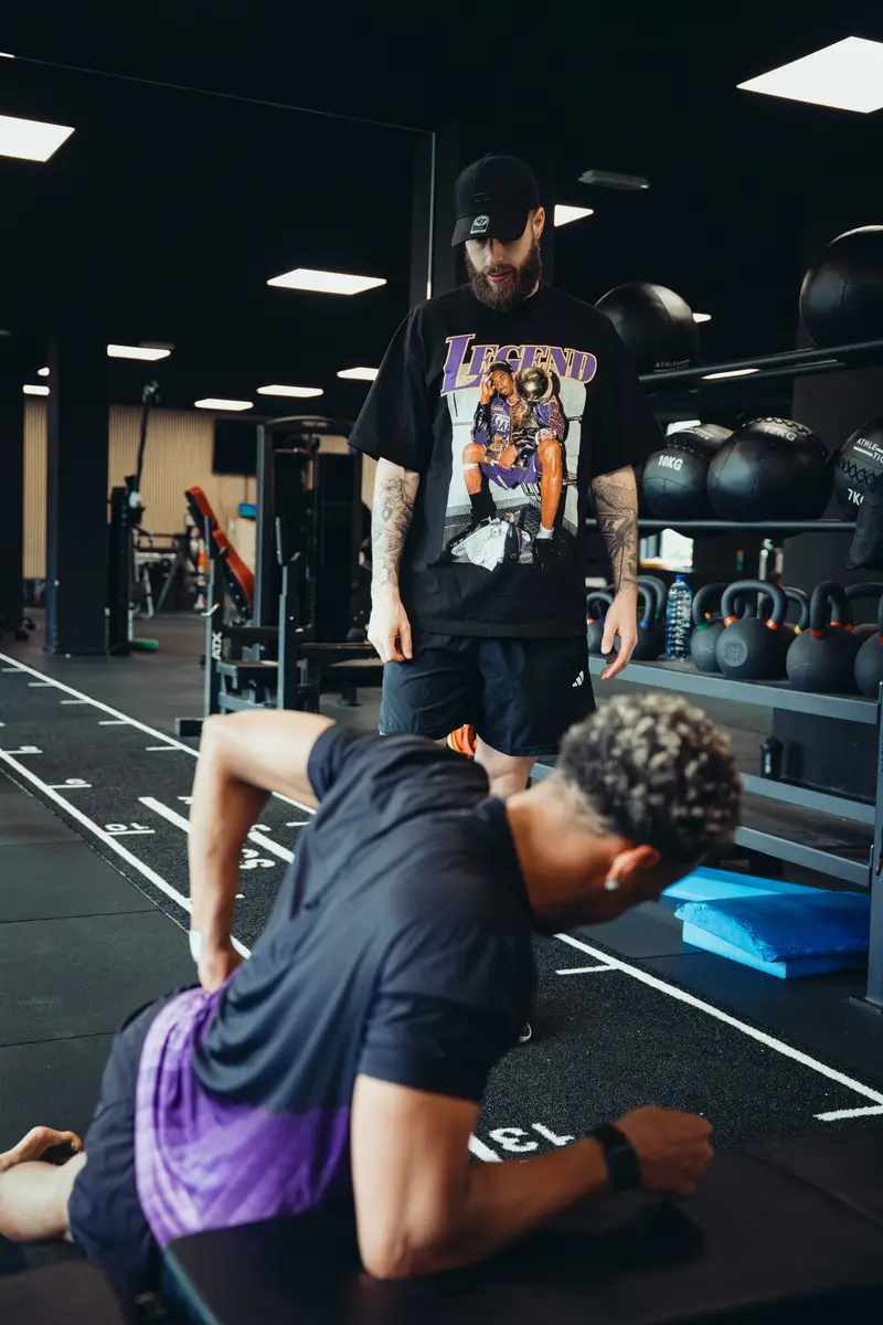 Coach supervising a plank variation